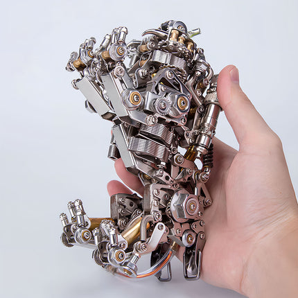  Hand holding a detailed metal model of a mechanical arm or robotic hand, showcasing the intricate metal kit components and steampunk puzzle artistry. This steam punk mech is a marvel of engineering.