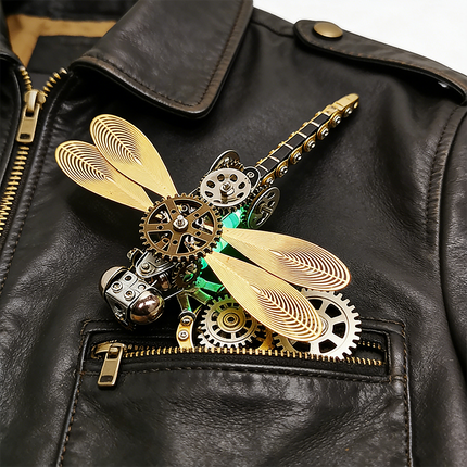 A stylish steampunk puzzle, a mechanical dragonfly with glowing accents, tucked into the pocket of a black leather jacket. This unique metal model serves as a striking piece of wearable art or a fascinating 3D puzzle Metal Kit, demonstrating the versatility of mechanical steampunk design and appealing to those who love distinct steampunk mech accessories.