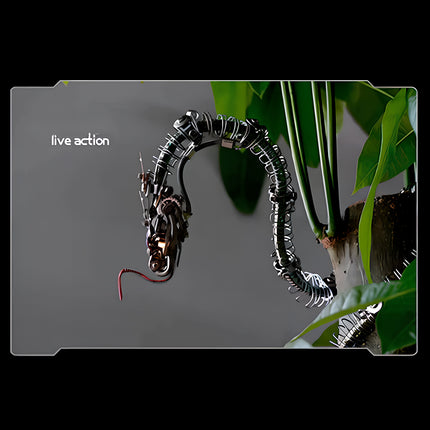 Live action" display of the "Sharp tattoo skeleton (green snake)" metal model kit coiled around a plant stem.