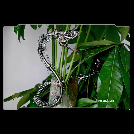  Live action scene: A detailed metal model kit cobra gracefully coiled around lush green plants, highlighting a dynamic metallic 3D puzzle display.