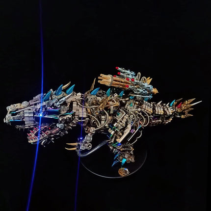 Finished **metal model kit** of a Tyrannosaurus Rex built from stainless steel parts with blue light effects.