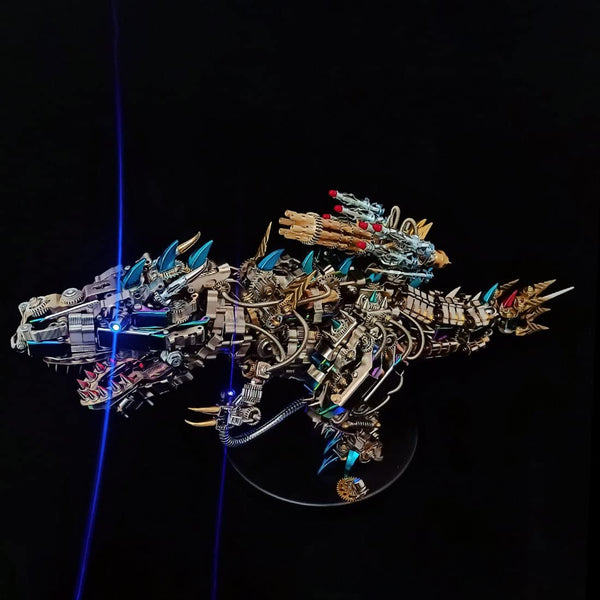 Finished **metal model kit** of a Tyrannosaurus Rex built from stainless steel parts with blue light effects.