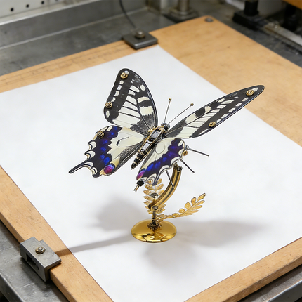 A precise steampunk puzzle, a mechanical swallowtail butterfly with striking black, white, and blue wings, meticulously presented on a blank drafting board. This intricate metal model highlights superior mechanical steampunk design, making it an inspiring 3D puzzle Metal Kit for creators or a sophisticated steampunk mech display piece that bridges nature and engineering.