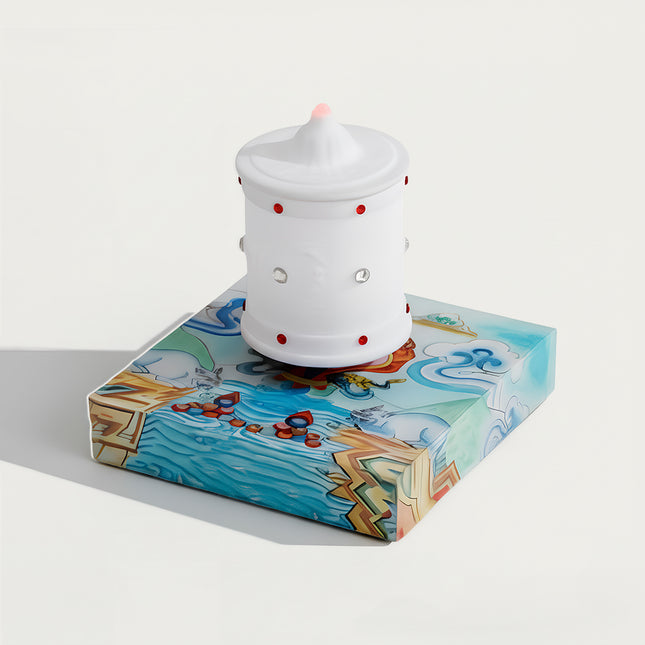Table Funny Magnetic Levitation Zen Lamp Artwork - A distinctive creation for cultural enthusiasts, spiritual seekers, and decor admirers, this piece from Table Funny features a magnetic levitation zen lamp with a vividly illustrated base inspired by Tibetan art, a traditional white prayer wheel-inspired design with red accents, and a thematic spiritual design. Highlighted by its floating zen-inspired silhouette, magnetic levitation technology, Tibetan cultural elements, and vibrant artistic detailing