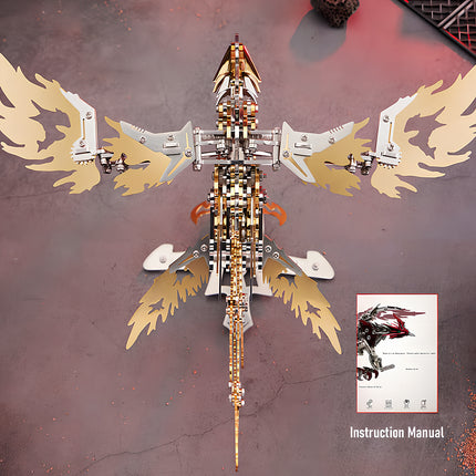 Overhead view of an assembled golden mechanical phoenix metal model kit, with its "Instruction Manual" visible. This metallic 3D puzzle highlights the rewarding completion of a detailed build.