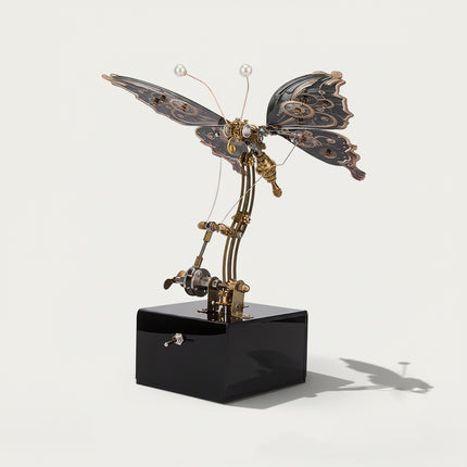 Side view of a bronze-winged steampunk butterfly metal model with pearl antennae, a distinguished funny table art piece. This DIY 3D puzzle metal kit offers a sophisticated decorative touch for any space.