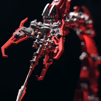 Close-up of the red mechanical scorpion's intricate tail and stinger, showcasing detailed gears and a menacing design. This DIY 3D puzzle highlights the fine craftsmanship of the Metal Kits, perfect for a captivating funny table display.