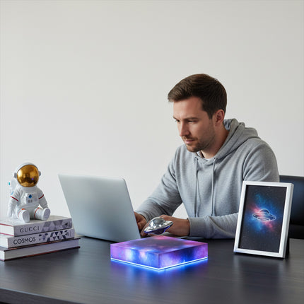 A magnetic levitation UFO suspended on a magnetic levitation base—a unique anti-gravity desk lamp for modern office decor.