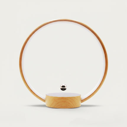 Table Funny Magnetic Levitation Minimalist Decor - An innovative creation for design enthusiasts, tech lovers, and minimalist decor admirers, this piece from Table Funny features a magnetic levitation decor with a wooden circular frame, subtle ambient lighting, and a tiny metallic floating sphere. Highlighted by its floating minimalist silhouette, magnetic levitation technology, clean lines, and natural wood texture integration