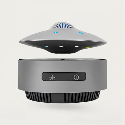 Table Funny Magnetic Levitation UFO-inspired Device Artwork - An innovative creation for tech enthusiasts, sci-fi lovers, and modern decor admirers, this piece from Table Funny features a magnetic levitation device with a sleek gray base, a UFO-inspired design with multi-colored LED accents and functional controls, and a futuristic aesthetic. Highlighted by its floating tech-inspired silhouette, magnetic levitation technology, integrated functionality, and minimalist industrial design