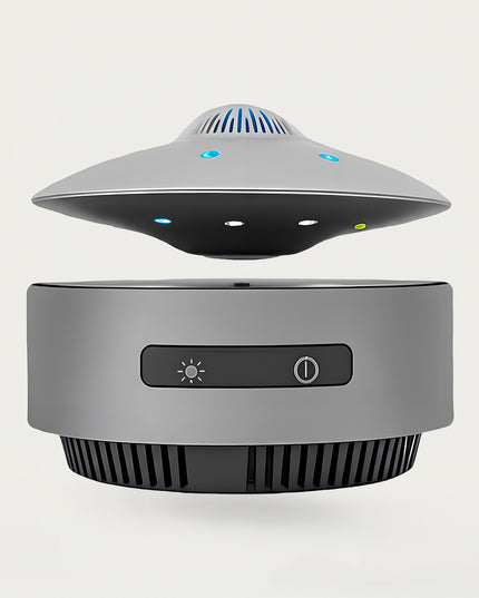 Table Funny Magnetic Levitation UFO-inspired Device Artwork - An innovative creation for tech enthusiasts, sci-fi lovers, and modern decor admirers, this piece from Table Funny features a magnetic levitation device with a sleek gray base, a UFO-inspired design with multi-colored LED accents and functional controls, and a futuristic aesthetic. Highlighted by its floating tech-inspired silhouette, magnetic levitation technology, integrated functionality, and minimalist industrial design