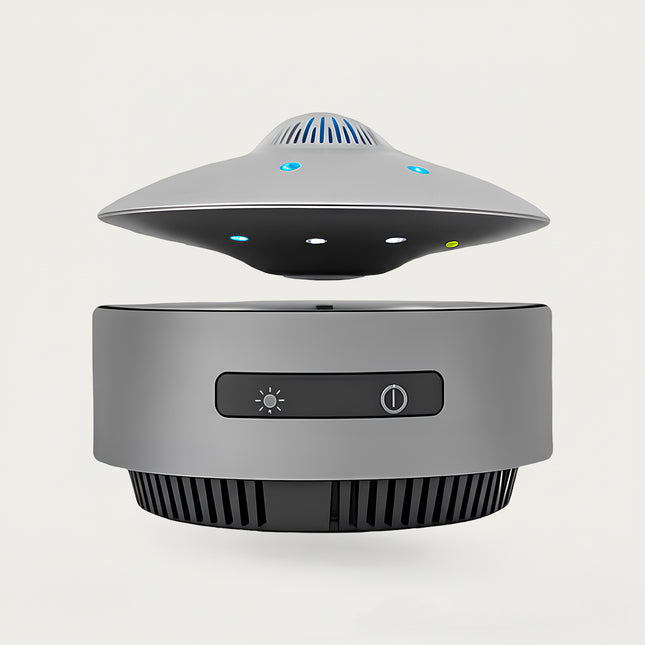 Table Funny Magnetic Levitation UFO-inspired Device Artwork - An innovative creation for tech enthusiasts, sci-fi lovers, and modern decor admirers, this piece from Table Funny features a magnetic levitation device with a sleek gray base, a UFO-inspired design with multi-colored LED accents and functional controls, and a futuristic aesthetic. Highlighted by its floating tech-inspired silhouette, magnetic levitation technology, integrated functionality, and minimalist industrial design