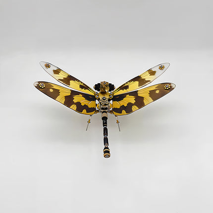 A vibrant steampunk puzzle, a striking mechanical dragonfly with bold yellow and brown patterned wings and a matching body, presented against a clean white background. This exquisite metal model showcases a unique mechanical steampunk design, making it an eye-catching 3D puzzle Metal Kit for enthusiasts or a distinctive steampunk mech decorative piece that stands out with its striking coloration.