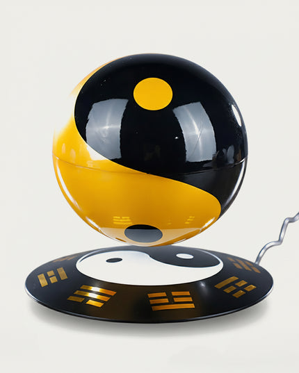 Table Funny Magnetic Levitation Tai Chi Sphere Artwork - A distinctive creation for cultural enthusiasts, tech lovers, and decor admirers, this piece from Table Funny features a magnetic levitation Tai Chi sphere with a themed base adorned with Bagua symbols, striking black-and-gold color scheme, and a classic philosophical design. Highlighted by its floating symbolic sphere silhouette, magnetic levitation technology, traditional Chinese cultural elements, and bold color contrast