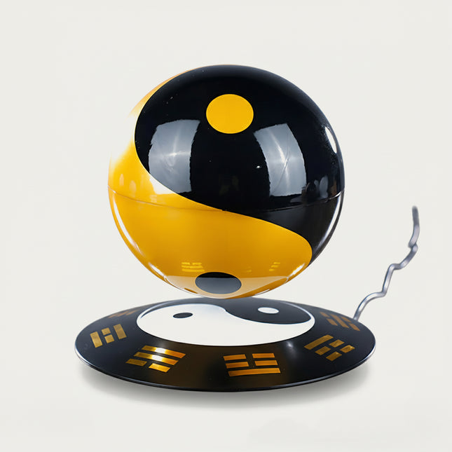 Table Funny Magnetic Levitation Tai Chi Sphere Artwork - A distinctive creation for cultural enthusiasts, tech lovers, and decor admirers, this piece from Table Funny features a magnetic levitation Tai Chi sphere with a themed base adorned with Bagua symbols, striking black-and-gold color scheme, and a classic philosophical design. Highlighted by its floating symbolic sphere silhouette, magnetic levitation technology, traditional Chinese cultural elements, and bold color contrast