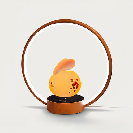 Table Funny Magnetic Levitation Rabbit Lamp Artwork - A charming creation for home decor lovers, cultural design admirers, and lighting enthusiasts, this piece from Table Funny features a magnetic levitation rabbit-shaped lamp with a wooden circular frame, warm ambient lighting, and an adorable rabbit design adorned with floral motifs. Highlighted by its cute floating rabbit silhouette, magnetic levitation technology, traditional-inspired aesthetic, and natural wooden textures