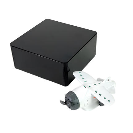 “White magnetic levitation model airplane next to a sleek black gift box – premium anti-gravity desk toy packaging