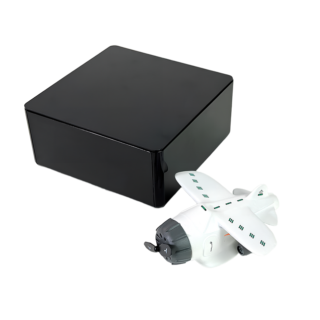 “White magnetic levitation model airplane next to a sleek black gift box – premium anti-gravity desk toy packaging