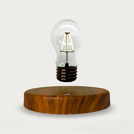 Table Funny Magnetic Levitation Light Bulb Artwork - An innovative creation for design enthusiasts, tech lovers, and novelty decor admirers, this piece from Table Funny features a magnetic levitation light bulb with a natural wooden base, a vintage-inspired filament bulb design, and a minimalist aesthetic. Highlighted by its floating luminous silhouette, magnetic levitation technology, retro-modern contrast, and organic wood texture integration, it’s a captivating decor piece that merges lighting art