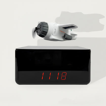 Magnetic Levitation Plane Digital Clock - A playful tech decor piece for aviation fans, gadget lovers, and daily life users, this is a magnetic levitation plane-themed digital clock. It features a floating white plane model (with propeller details), a sleek black digital display base (with red LED readout), and a stable magnetic levitation structure, paired with a modern playful aesthetic. Highlighted by its eye-catching floating plane design