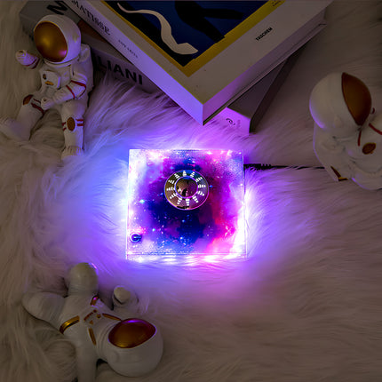 Magnetic levitation globe with starry base, illuminated with purple light, creating a dreamy and relaxing atmosphere