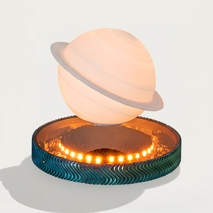 Saturn Magnetic Levitation Lamp - A cosmic-themed decor light for space enthusiasts, design lovers, and ambient lighting fans, this is a Saturn-inspired magnetic levitation lamp. It features a soft-glowing Saturn-shaped light (with realistic ring details), a stable magnetic levitation base (integrated with warm LED accent lights), and a textured wave-patterned base (in teal-blue tones), paired with a dreamy cosmic aesthetic