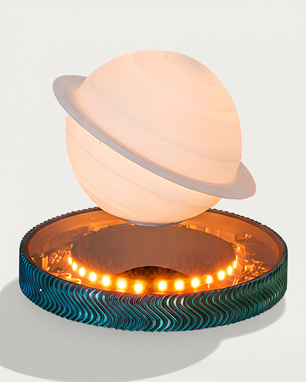 Saturn Magnetic Levitation Lamp - A cosmic-themed decor light for space enthusiasts, design lovers, and ambient lighting fans, this is a Saturn-inspired magnetic levitation lamp. It features a soft-glowing Saturn-shaped light (with realistic ring details), a stable magnetic levitation base (integrated with warm LED accent lights), and a textured wave-patterned base (in teal-blue tones), paired with a dreamy cosmic aesthetic
