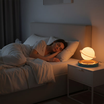 Magnetic levitation Saturn planet lamp floats above a textured base—a color-changing sphere with a warm glow, perfect for bedroom ambiance, bedside lighting, and creative gifts