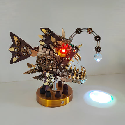 Illuminated mechanical steampunk anglerfish lamp metal model 3D puzzle Metal Kit, featuring a menacing design with sharp teeth, intricate gears, glowing red eyes, and an articulated lure with a crystal light. This captivating steam punk mech also serves as a functional steampunk puzzle light.