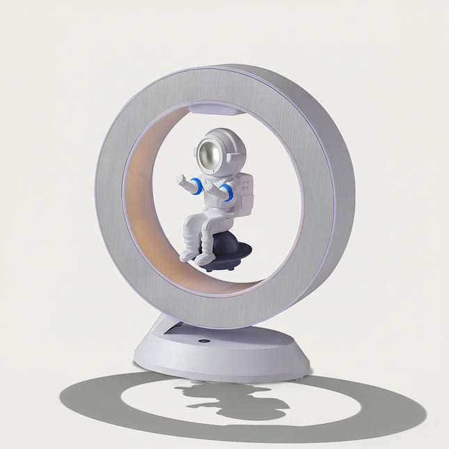 Table Funny Magnetic Levitation Astronaut Artwork - An innovative creation for space enthusiasts, tech lovers, and design admirers, this piece from Table Funny features a magnetic levitation astronaut decor with a sleek circular frame, warm ambient lighting, and a detailed astronaut design. Highlighted by its floating astronaut silhouette, magnetic levitation technology, space-themed aesthetic, and modern structural design, it’s a captivating decor piece that merges space art, technological innovation 