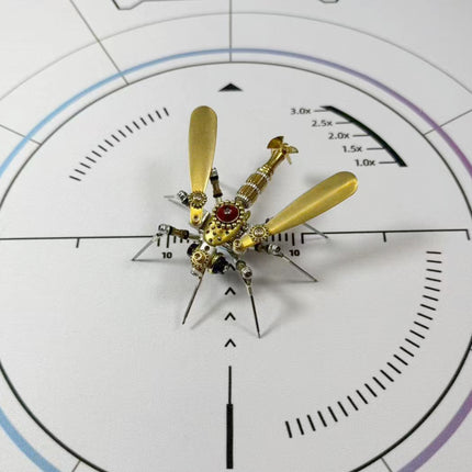 Steampunk mosquito 3D puzzle metal kit on a white measurement mat. This intricate mechanical steampunk insect features brass wings and detailed gears, perfect for collectors.