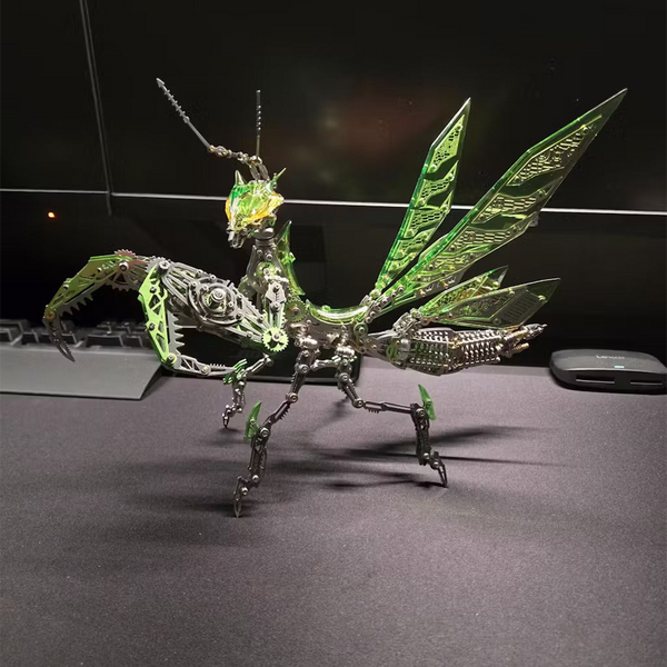  Impressive mechanical steampunk praying mantis metal model with glowing green wings and intricate body details, a futuristic steampunk puzzle from 3D puzzle Metal Kits, displayed on a desk.