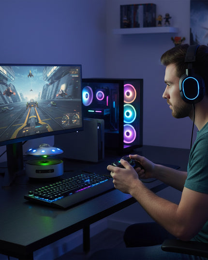 The magnetic levitation Bluetooth speaker floats above a color-changing galaxy base, displayed on a gaming desk featuring an RGB case and keyboard—a perfect blend of gamer ambiance and creative gifting