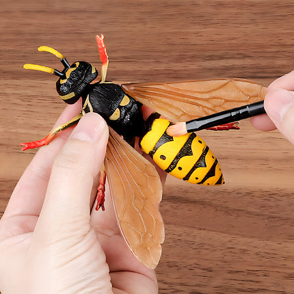 Hands painting a realistic wasp model, part of our DIY Metal Kits 3D puzzle collection, offering a fun and creative funny table activity for model enthusiasts
