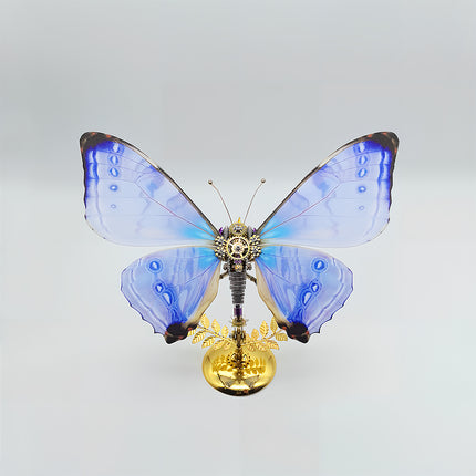 This is a Tablefunny steampunk mechanical butterfly 3D metal puzzle kit: Made of metal, it replicates the butterfly’s form, featuring transparent wings with blue-purple gradient paired with mechanical components like gears, plus a golden branch-and-leaf base—it’s a creatively designed decorative 3D metal model toy.