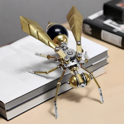 This is a steampunk-style mechanical small wasp, assembled via 3D metal puzzles. It features brass/silver alloy parts (gears, angular wings, articulated legs) with a black-accented abdomen, displayed as a desk decor on books.Highlighted by retro-industrial styling and compact, detailed craftsmanship, it’s a charming collectible blending 3D puzzle art and steampunk insect design.