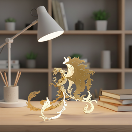 Golden Metal Vermilion Bird 3D Puzzle, displayed on a desk with a lamp and books, is an elegant DIY metal model perfect for a sophisticated and charming desktop