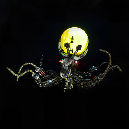 Front view of a **mechanical metal puzzle** octopus with intricate chain tentacles holding an illuminated yellow sphere.