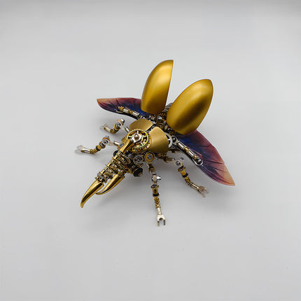 This is a Tablefunny steampunk mechanical beetle 3D metal puzzle kit: Made of gold and silver metal, it replicates the beetle’s form, featuring a shiny gold curved shell paired with transparent wings with purple gradient, plus a mechanical curved-horn head. Gears, axles and other components are densely arranged on the body and multiple legs—it’s a creatively designed decorative 3D metal model toy.