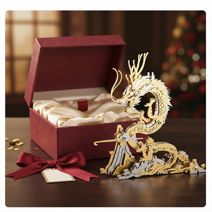Golden and silver metal dragon 3D puzzle presented as a gift next to an open red box and ribbon, an exquisite Metal Kits DIY project perfect for a funny table centerpiece or special occasion