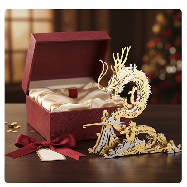 Golden and silver metal dragon 3D puzzle presented as a gift next to an open red box and ribbon, an exquisite Metal Kits DIY project perfect for a funny table centerpiece or special occasion