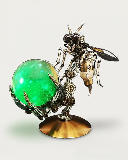 Steampunk bee metal model with green glowing orb on a copper base — a funny DIY 3D puzzle Metal Kits by table funny for table display.