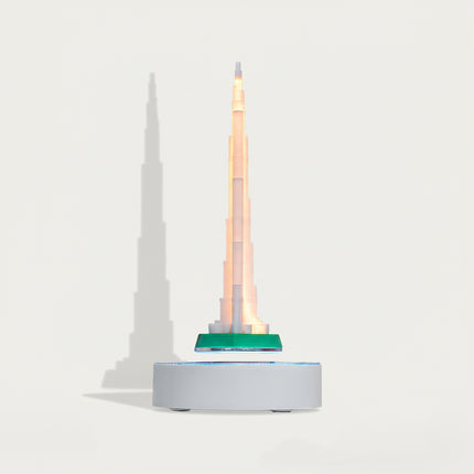 able Funny Magnetic Levitation Iron Tower Artwork - An innovative creation for architecture lovers, tech enthusiasts, and design admirers, this piece from Table Funny features a magnetic levitation model of the Iron Tower with a sleek white base, warm LED lighting, and a realistic architectural design. Highlighted by its precise structural detailing, floating landmark silhouette, magnetic levitation technology, and striking shadow effects