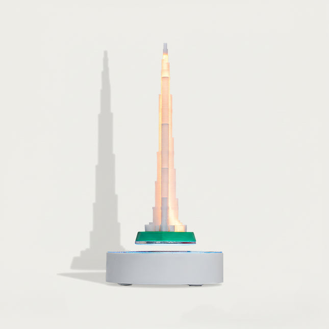 able Funny Magnetic Levitation Iron Tower Artwork - An innovative creation for architecture lovers, tech enthusiasts, and design admirers, this piece from Table Funny features a magnetic levitation model of the Iron Tower with a sleek white base, warm LED lighting, and a realistic architectural design. Highlighted by its precise structural detailing, floating landmark silhouette, magnetic levitation technology, and striking shadow effects