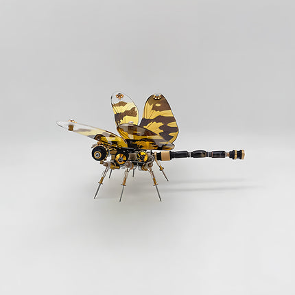 A sleek steampunk puzzle, a mechanical dragonfly with striking yellow and brown camouflage-patterned wings and an elongated body, viewed from the side against a clean white background. This intricate metal model highlights innovative mechanical steampunk design, making it an appealing 3D puzzle Metal Kit for hobbyists or a distinctive steampunk mech decorative piece with a modern, tactical aesthetic.