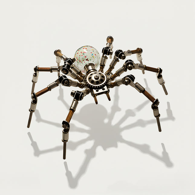Table Funny 3D Puzzle Metal Kits Spider-Form Artwork - A unique eclectic creation for DIY enthusiasts, industrial/mechanical design lovers, and decor admirers, this piece from Table Funny is an elaborate spider-form artwork assembled from 3D puzzle metal kits. It features a silver-brass metallic structure paired with a colorful confetti glass spherical core, articulated multi-jointed legs (with copper-wrapped segments), and exposed gear mechanics