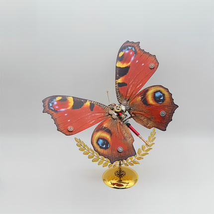 Red-brown peacock-eye steampunk butterfly DIY 3D puzzle metal model - mechanical funny table decor from metal kits, golden leaf stand with red-silver gear accents