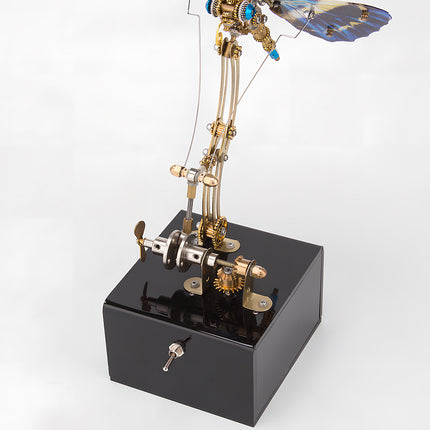 Detailed mechanical base of a blue-winged steampunk butterfly metal model, an impressive funny table display component. This DIY 3D puzzle metal kit's base highlights intricate gear work and functional design.