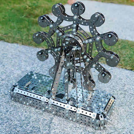 A completed steampunk puzzle Ferris wheel from high-quality 3D puzzle Metal Kits, featuring an industrial design with nuts and bolts.
