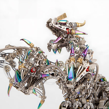  Close-up of the two intricate heads of a mechanical dragon, highlighting the gears, iridescent spikes, and detailed construction of this metallic 3D puzzle and metal model kit.
